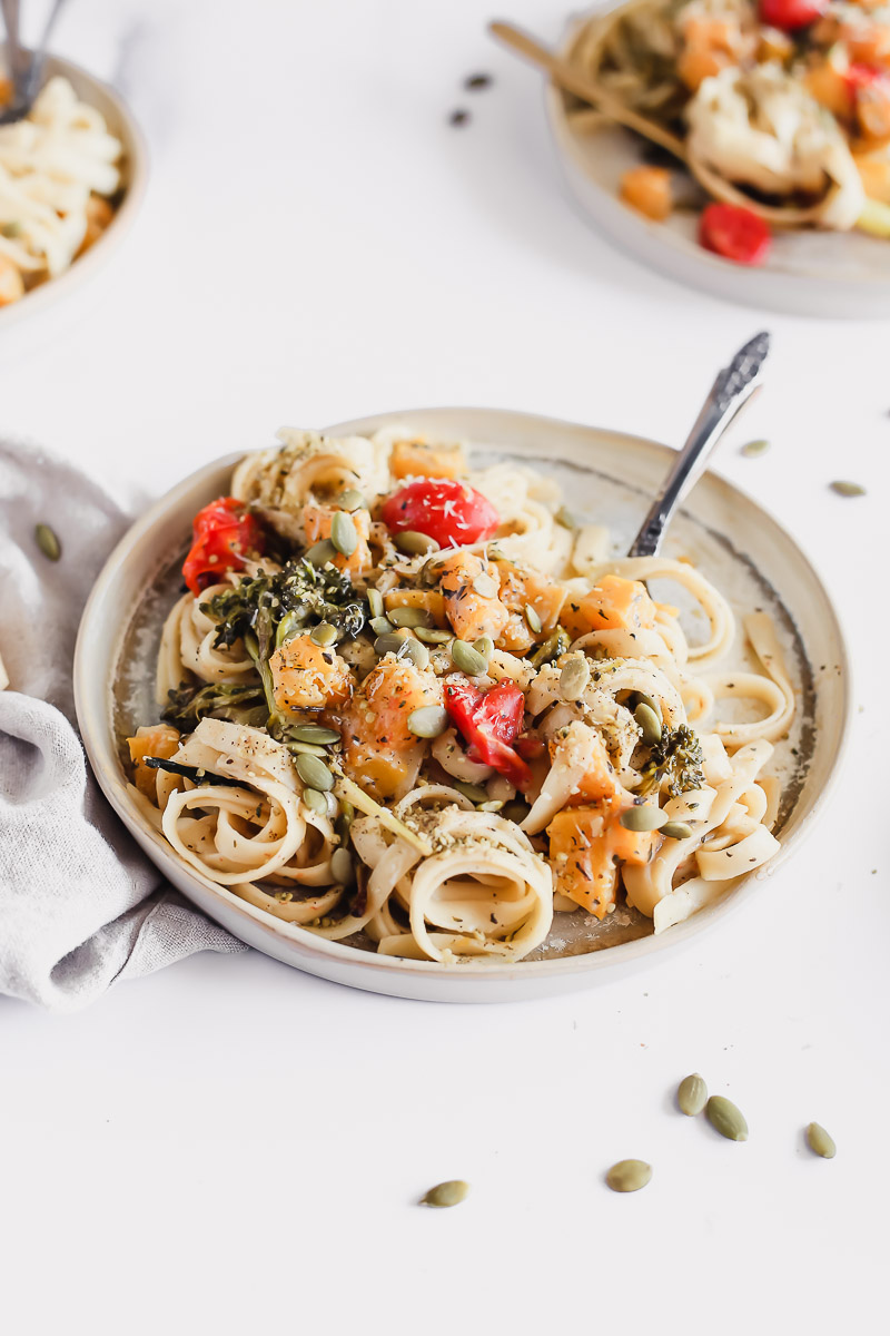 Roasted Butternut Squash, Broccolini, and Grape Tomatoes in a creamy vegan pasta sauce by Pasta-based. 