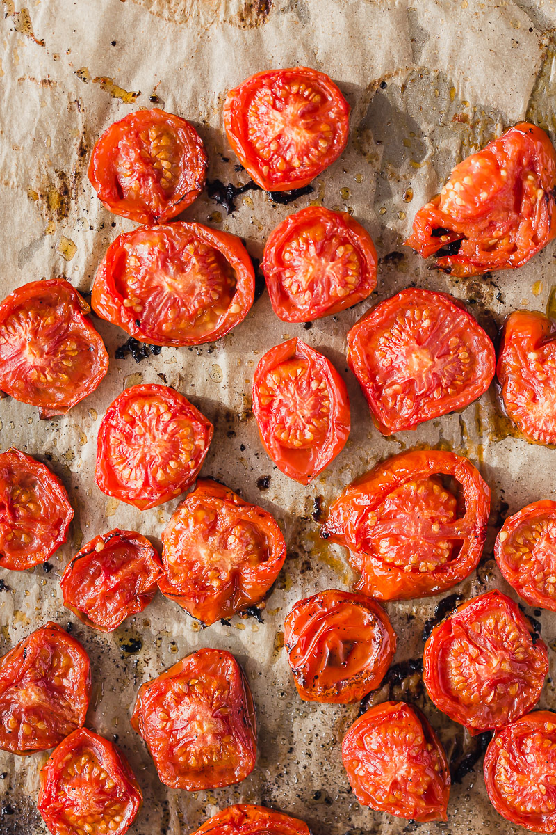 Oven Roasted Campari Tomatoes by Pasta-based. Juicy, bright red, sliced campari tomatoes roasted with a light olive oil drizzle on natural unbleached parchment paper.