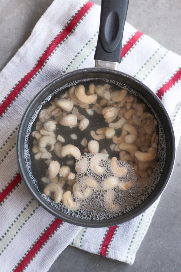 Quickly Soak Cashews in a small pot of hot water.