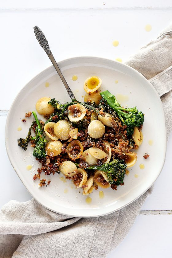 Italian Sausage Crumbles by Pasta-based. A plate of orecchiette pasta mixed with broccolini, vegan sausage crumbles, and fresh browned garlic.