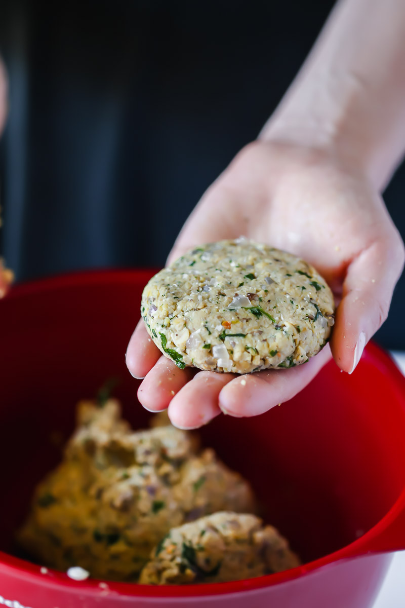 Shaping the patties of vegan tempeh slides, about the size of the palm of your hand. 