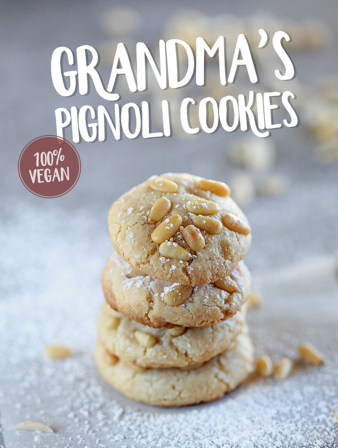 Vegan Italian Pignoli Cookies by Pasta-based. A stack of pignoli cookies sprinkled with powdered sugar. Text reads: Grandma's Pignoli Cookies. 100% Vegan.