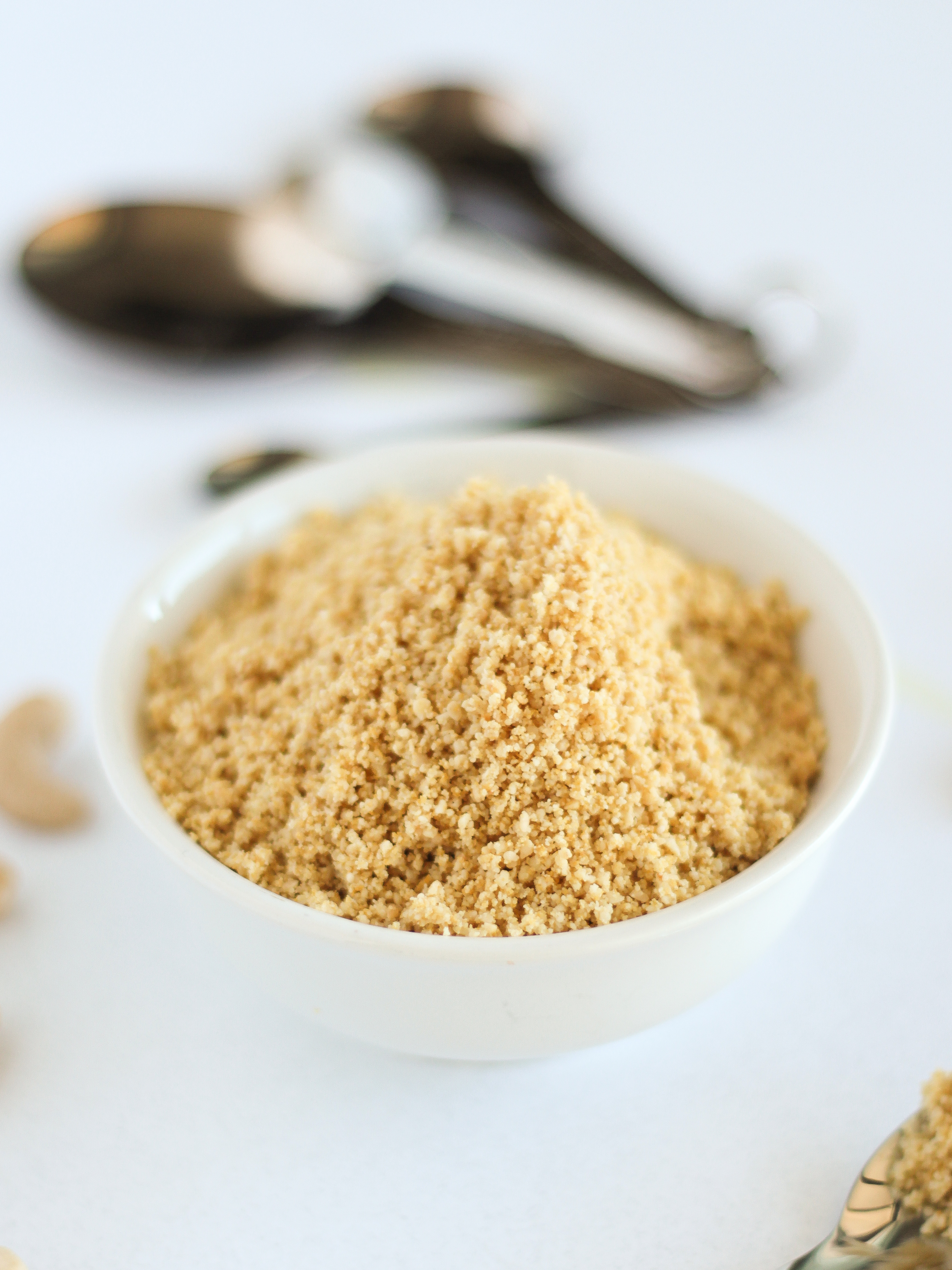 How to make vegan parmesan cheese by Pasta-based. Nutty, crumbly, vegan parmesan cheese in a small bowl. 