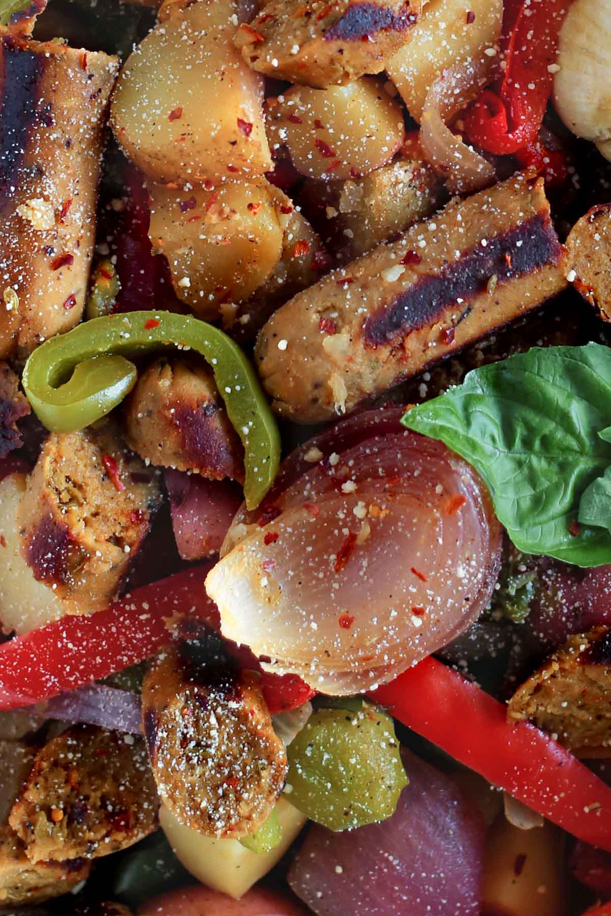 close-up of sausage, peppers, onions and potatoes.