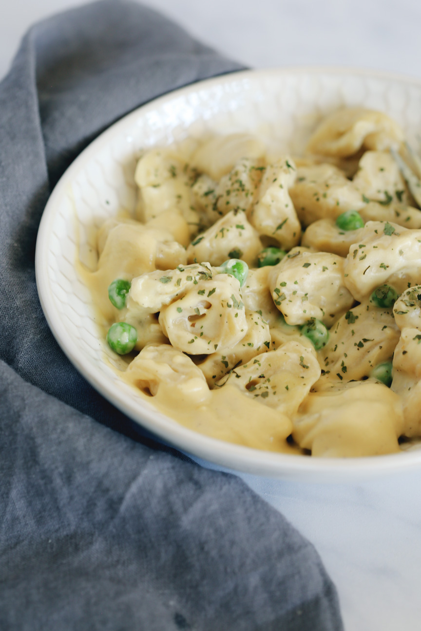 Alfredo sauce with vegan tortellini.